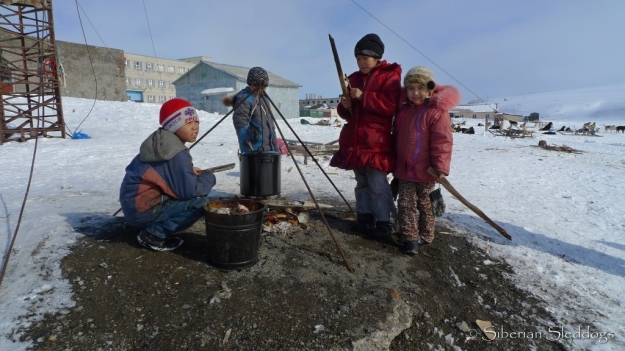 Local kids in Uelen made sure to keep bonfires going and kept an eye on the boiling walrus soup